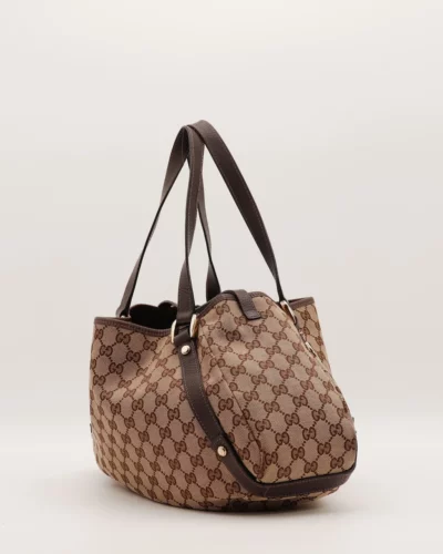Zijaanzicht van de Gucci Abbey Canvas Tote Bag met leren details
